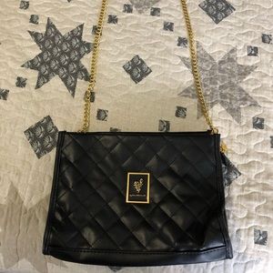 Black purse, gold chain